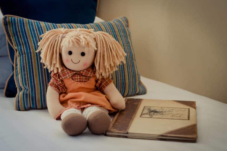 Child's doll on the bed in family room in Rochestown Lodge Hotel Dun Laoire