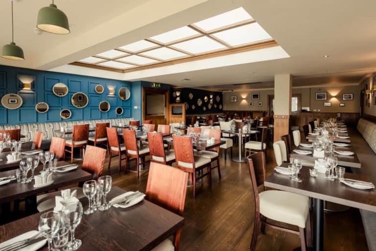 Full dining area set up for dinner in the Lodge restaurant Dun Laoghaire