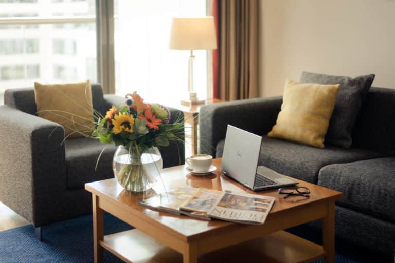PREMIER SUITES Dublin Sandyford lounge with coffee table and comfortable sofa