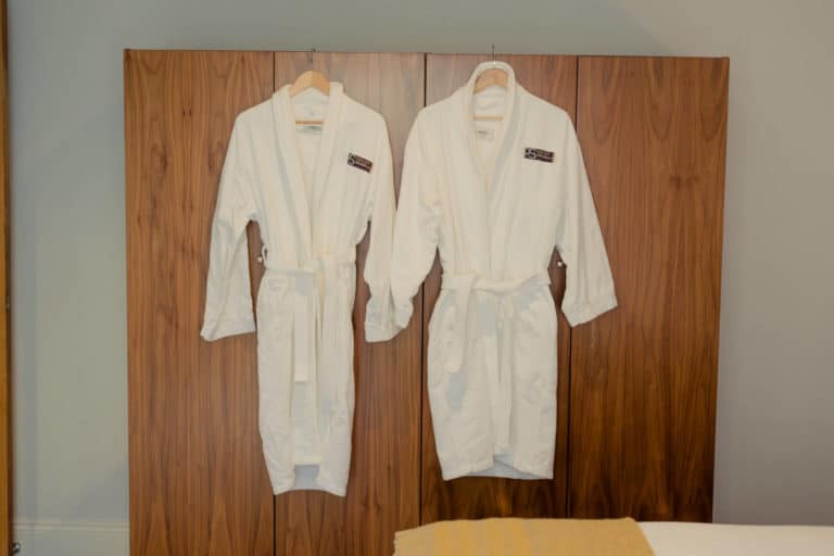 PREMIER SUITES PLUS Dublin Leeson Street 2 dressing gowns hanging from wardrobe hands connected