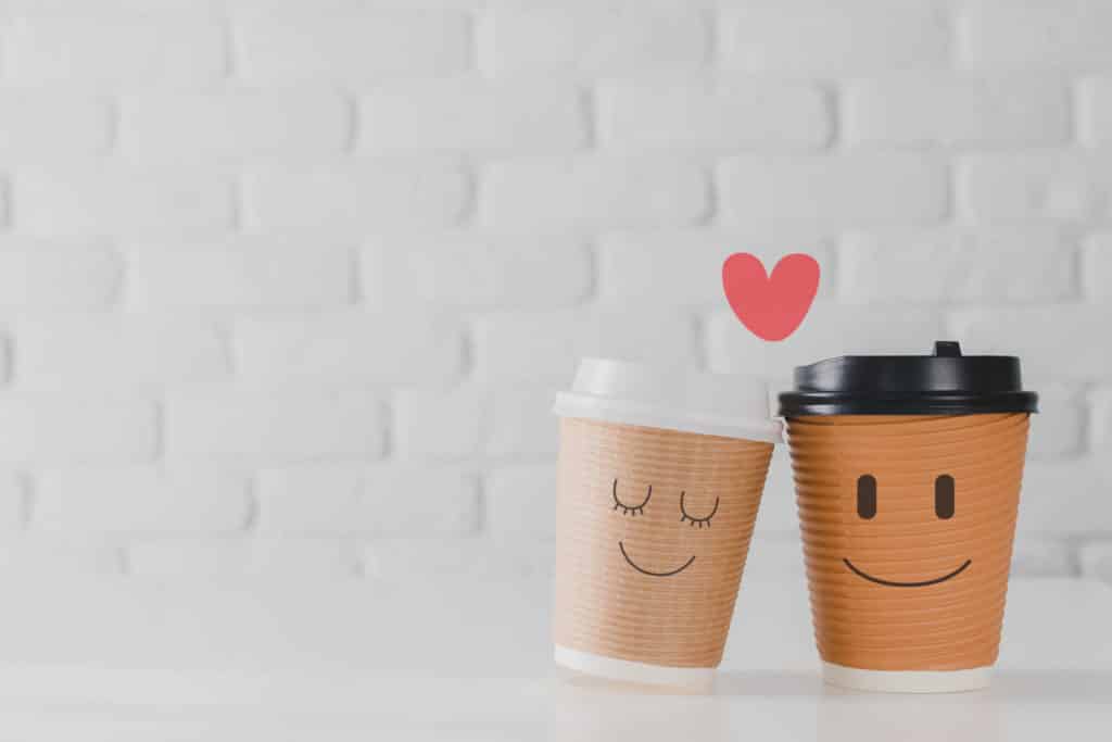 Two,Coffee,Cup,With,Smiling,Face,Of,Man,And,Woman