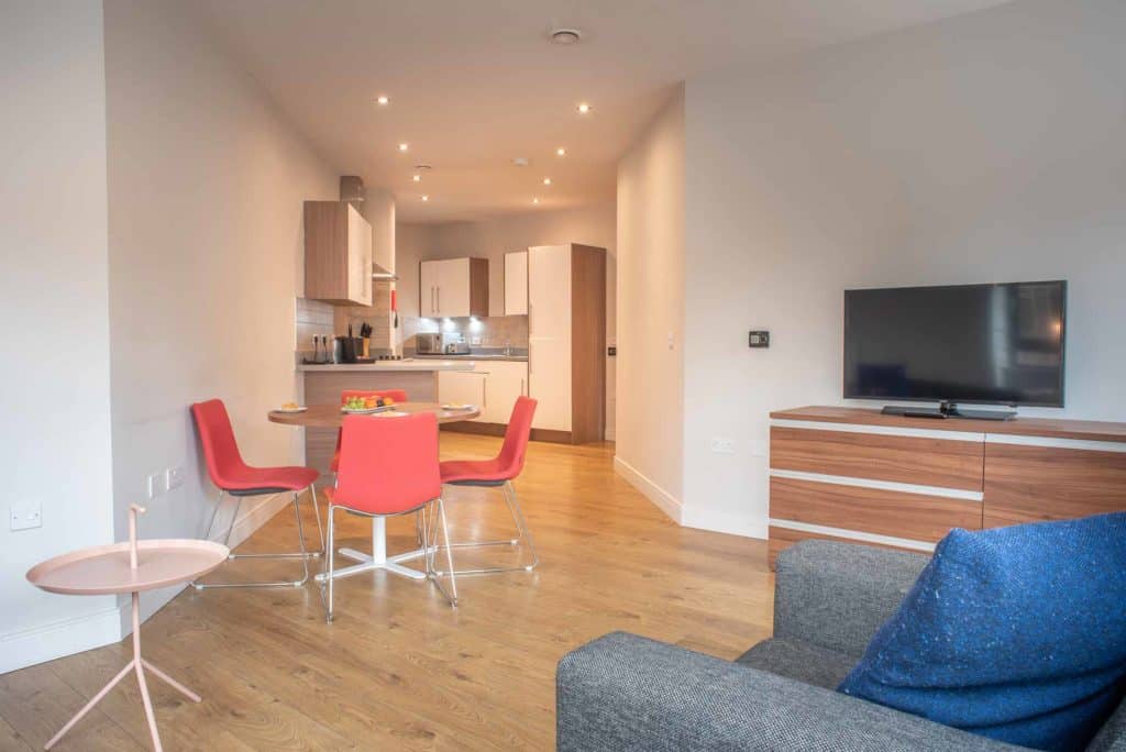 Open plan lounge and kitchen at PREMIER SUITES PLUS Glasgow Bath Street